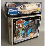 2 boxed Star Wars sets: AT-AT and Rebel Transport.