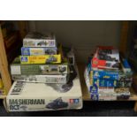 12x Assorted miliatry related model kits including Tamiya, Italieri and Airfix etc. (Contents not