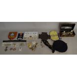 A good mixed lot of militaria including a death plaque, military buttons, EPNS spoons etc,