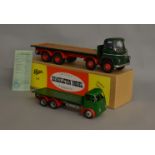 A vintage 1950s Shackleton Foden clockwork lorry in green with red arches, together with a 21st