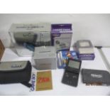 A boxed Gameboy Advanced SP along with another one, and various gameboy accessories, games etc