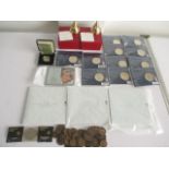 A collection of coins including a silver proof £2 coin along with £5 coins, commemorative crowns