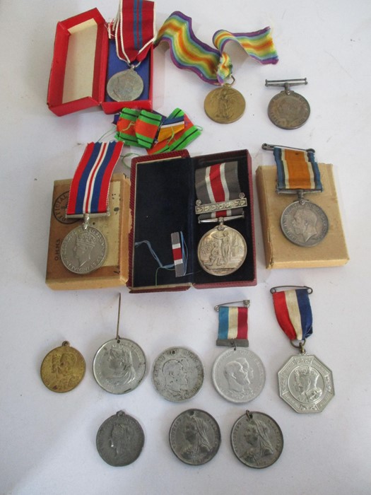 A collection of various medals including three WWI medals, ( awarded to F 15557, A.L.Warren, AM2