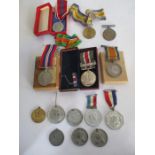 A collection of various medals including three WWI medals, ( awarded to F 15557, A.L.Warren, AM2