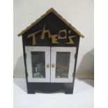 A diorama "Theo's" music shop with wooden building with musical instruments, records, sheet music