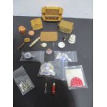 A collection of miniature dolls house items, kitchen related