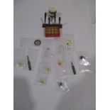 A collection of miniature dolls house breweriana including soda siphons , beer pumps, rum barrel,