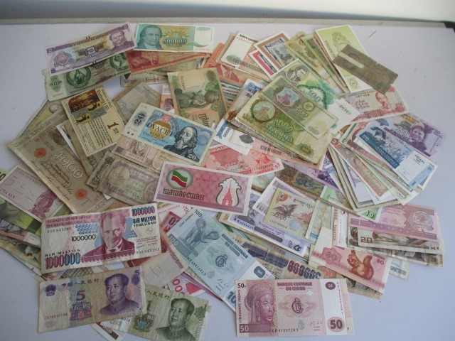 A collection of various world bank notes