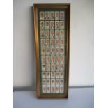 A collection of framed Players cricketers cigarette cards