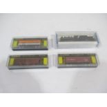 Four boxed Bachmann 'N' gauge items including one locomotive and tender, along with two box cars and