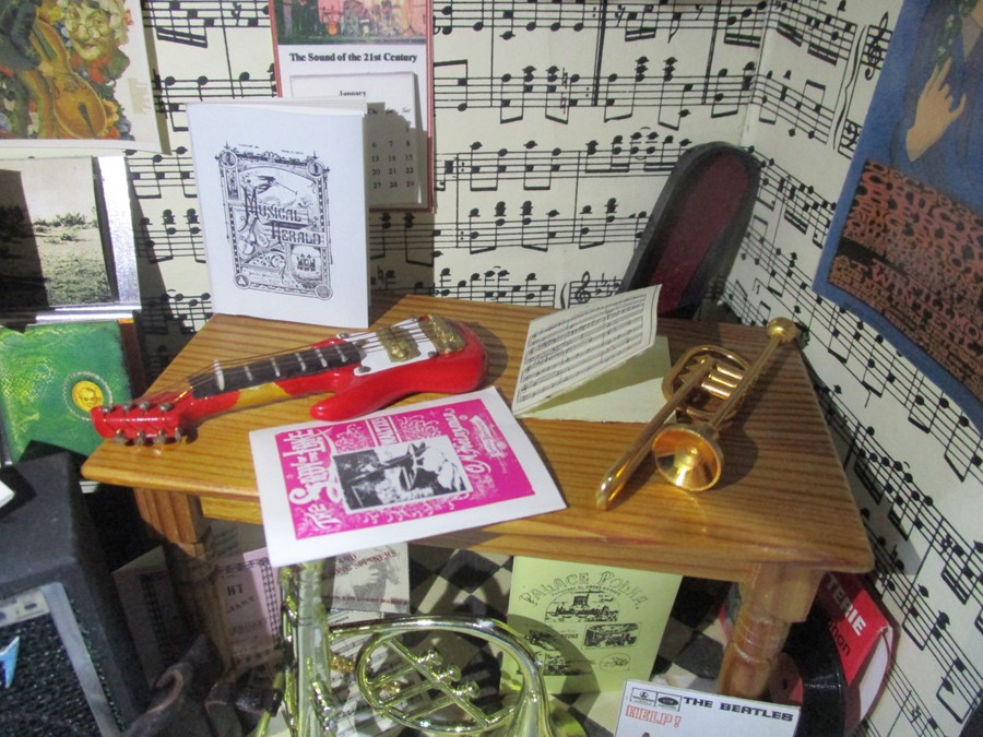 A diorama "Theo's" music shop with wooden building with musical instruments, records, sheet music - Image 7 of 12