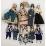 A collection of dolls house figures mainly in period style costumes