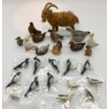 A collection of miniature dolls house animals, ducks, geese, doves, magpies and a goat