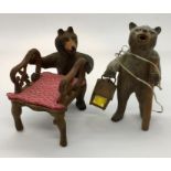A miniature dolls house carved "Black Forest Bear" chair along with a similar lamp formed as a