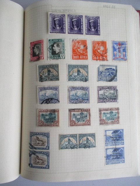 Two albums of various worldwide stamps along with an empty album - Image 18 of 55