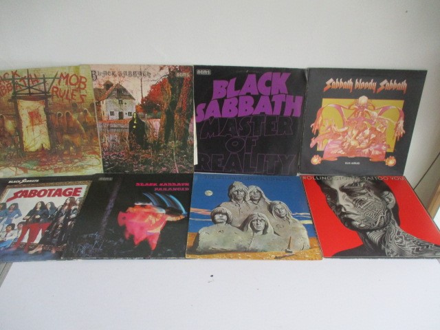 A collection of records including Rolling Stone Solid Rock and Tattoo You, Black Sabbath Master of