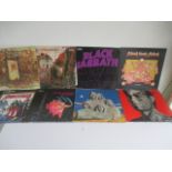 A collection of records including Rolling Stone Solid Rock and Tattoo You, Black Sabbath Master of