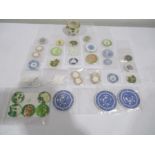 A collection of miniature dolls house china plates ( including Spode) along with candles and a