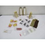 A collection of miniature dolls house kitchen items including step ladders, ironing boards,