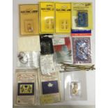 A collection of miniature dolls house items including electrical items- flicker units, lanterns,