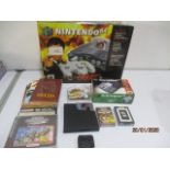 A boxed Nintendo 64 console along with games and other items