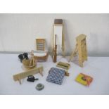 A collection of miniature dolls house kitchen items including ironing board, step ladder,