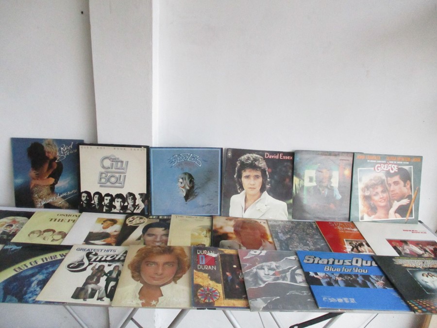 A collection of various LP's including Queen,Rod Stewart etc.