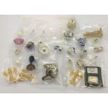 A collection of miniature dolls house items, china, wig stand, glass ware, candelabra, tissue box