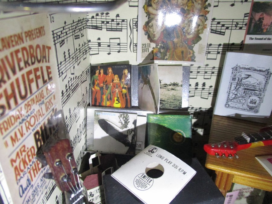 A diorama "Theo's" music shop with wooden building with musical instruments, records, sheet music - Image 11 of 12