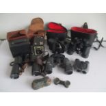 A collection of cameras and binoculars including Technar, Aquilus, opera glasses, Brownie etc