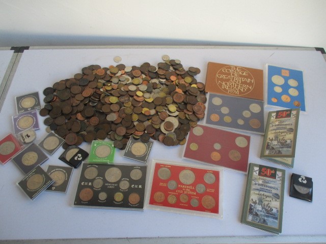 A collection of various world coins