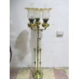 A Victorian floor standing triple oil lamp with adjustable height