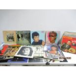 A collection of various records including The Beatles, Beach Boys, Pink Floyd, Jim Reeves, Bryan