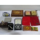 A collection of various items including Ercolano music boxes etc