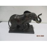 A bronzed figure of an elephant