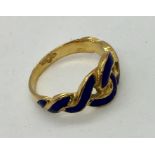 An 18ct gold ring with twisted enamel detailing- some damage to enamel, 3.7g