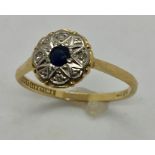 An 18ct gold diamond and sapphire cluster ring