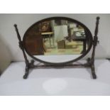 A mahogany toilet mirror