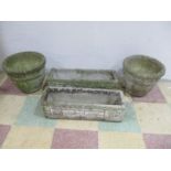 A pair of concrete garden pots along with a pair of concrete troughs