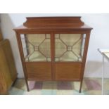 An inlaid Edwardian display cabinet