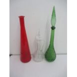 Two coloured glass decanters (one missing stopper) along with one other