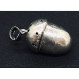 A hallmarked silver acorn shaped rattle