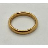 A 22 ct gold wedding band, 6.6g