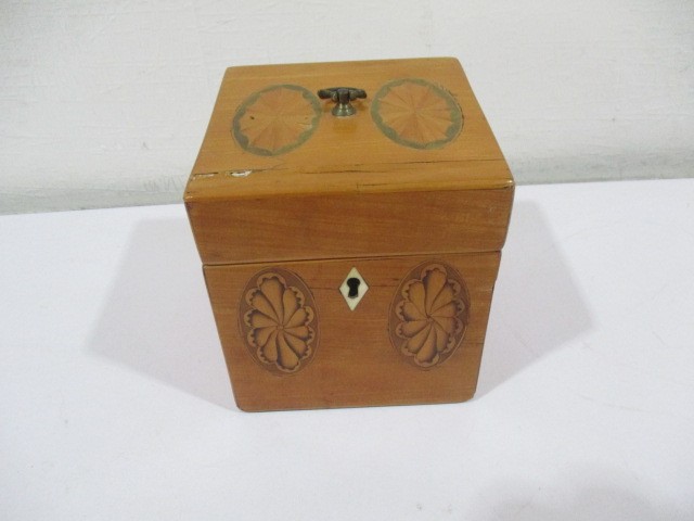 A Georgian inlaid tea caddy with shell decoration and ivory escutcheon