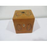 A Georgian inlaid tea caddy with shell decoration and ivory escutcheon