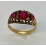 A Victorian 18ct gold ring with rubies plus diamond infill.