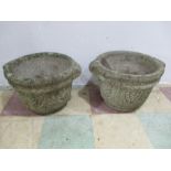 A pair of concrete garden pots