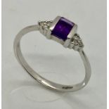 A 9ct white gold Art Deco design ring with diamonds and amethyst