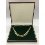 A 9 ct gold Grecian style necklace, 17.8g