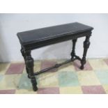 An ebonised console table